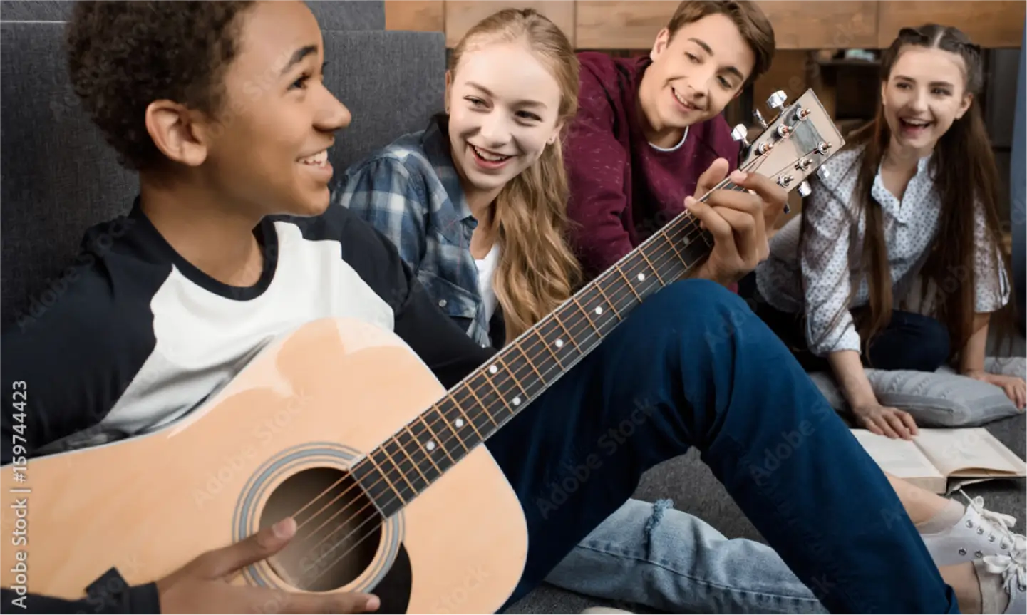 Teen playing guitar